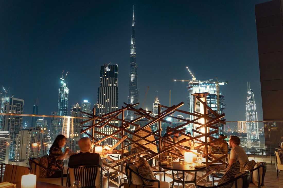 Rooftop terrace above the Dubai skyline at night