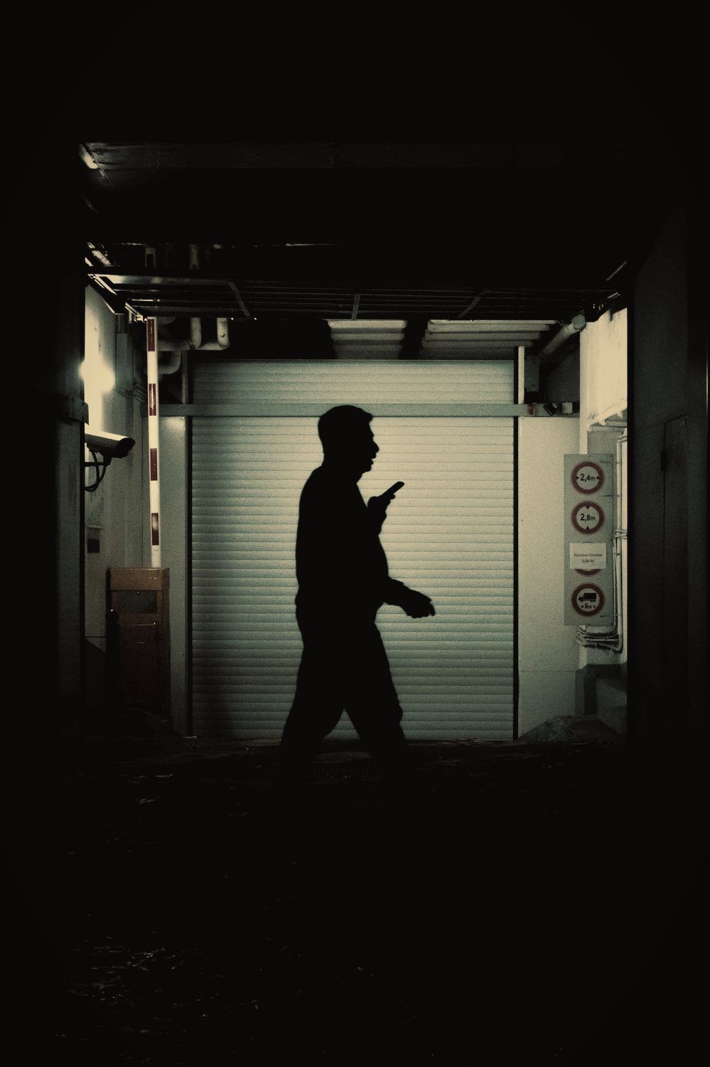 Officer walking a back-of-house corridor